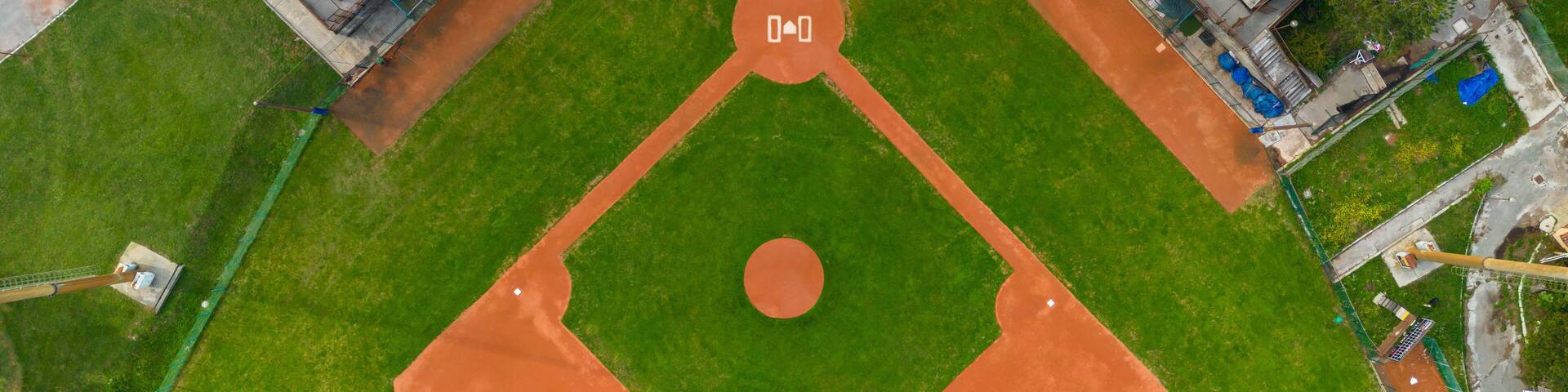 Drone Aerial View flying above a outdoor Baseball Field Diamond.