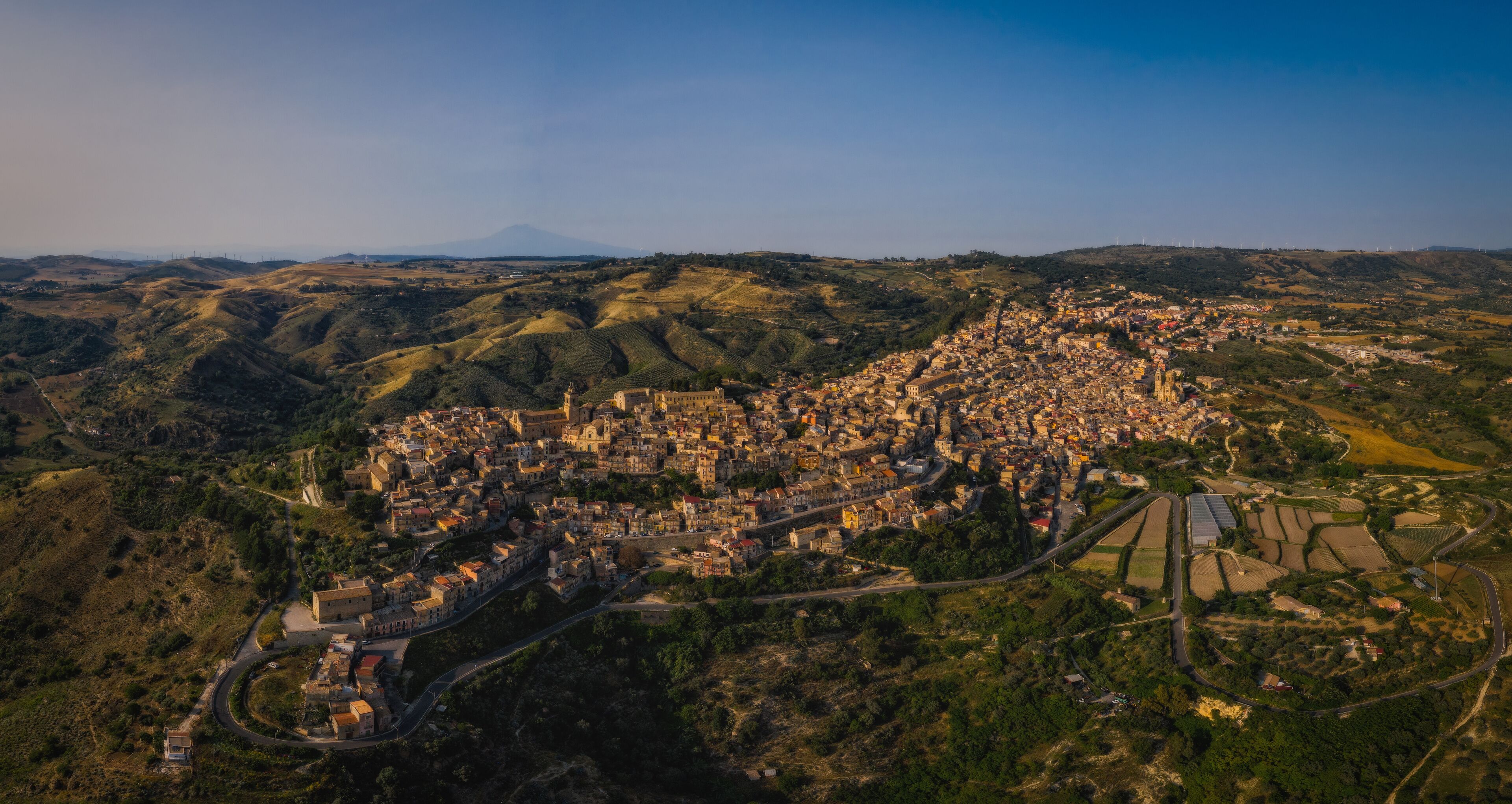 Panoramic aerial picture of Vizzini at sunset. Vizzini - picturesque Italian city in Sicily. June 2023