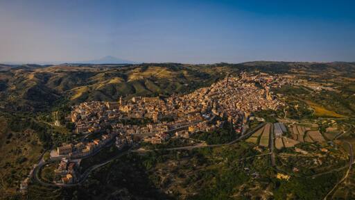 Panoramic aerial picture of Vizzini at sunset. Vizzini - picturesque Italian city in Sicily. June 2023