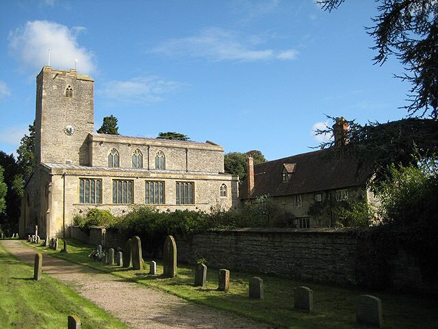 Priory church of St Mary, Deerhurst, Gloucestershire, seen from the southwest, with Priory Farmhouse on the right