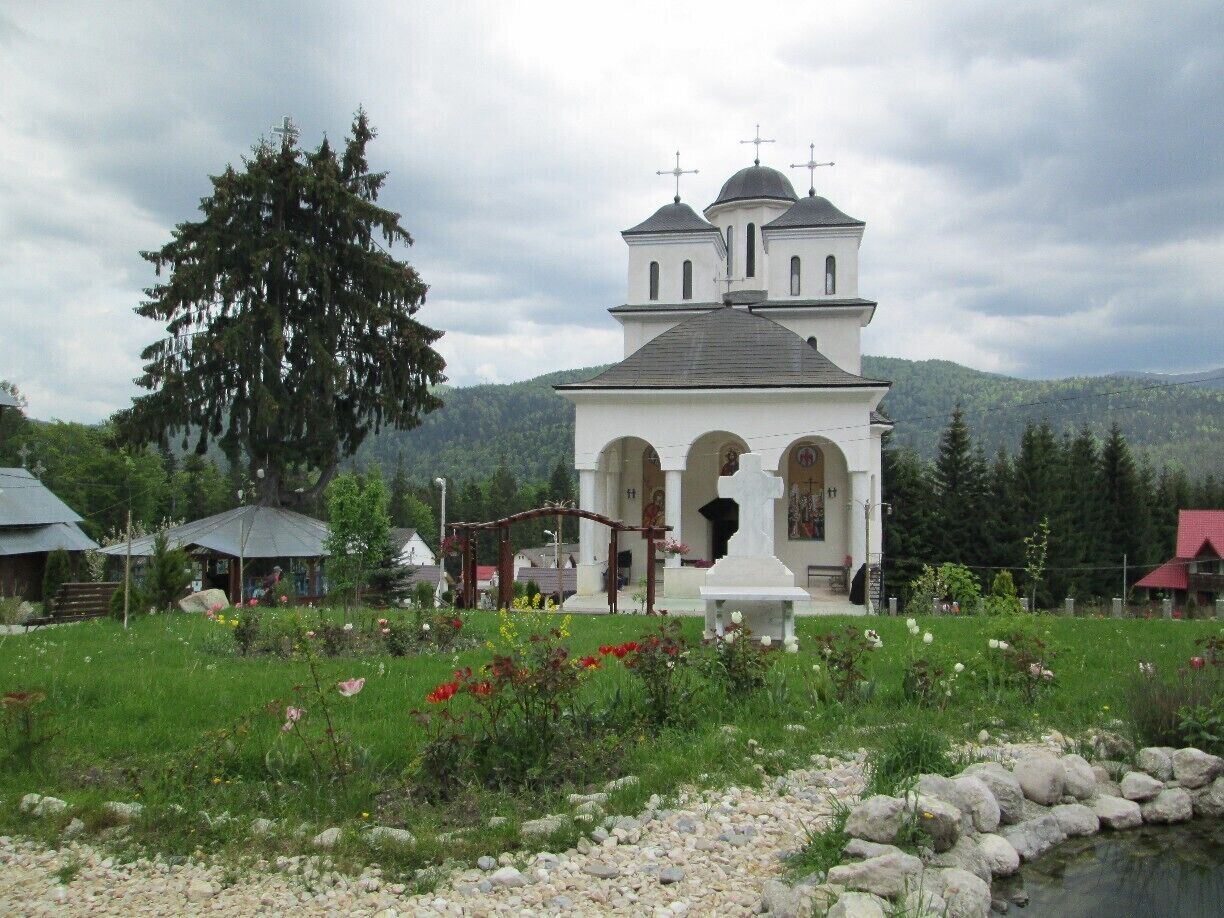 The Caraiman Monastery with the mountains in the background.