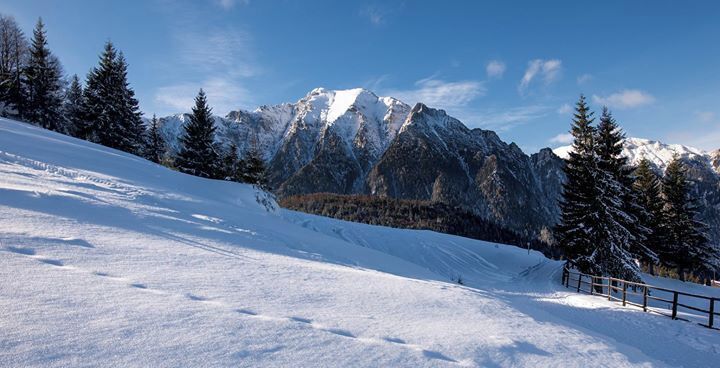 A snow-covered mountain landscape with a clear sky.