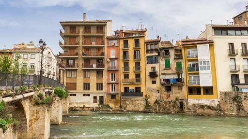 Colorful houses and bridge at the Ega river in Estella, Spain