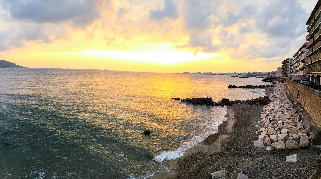 Panoramic sunset view of the sea ,the Akashi-Kaikyo Bridge links the city of Kobe on the Japanese mainland of Honshu to Iwaya on Awaji Island in Japan.