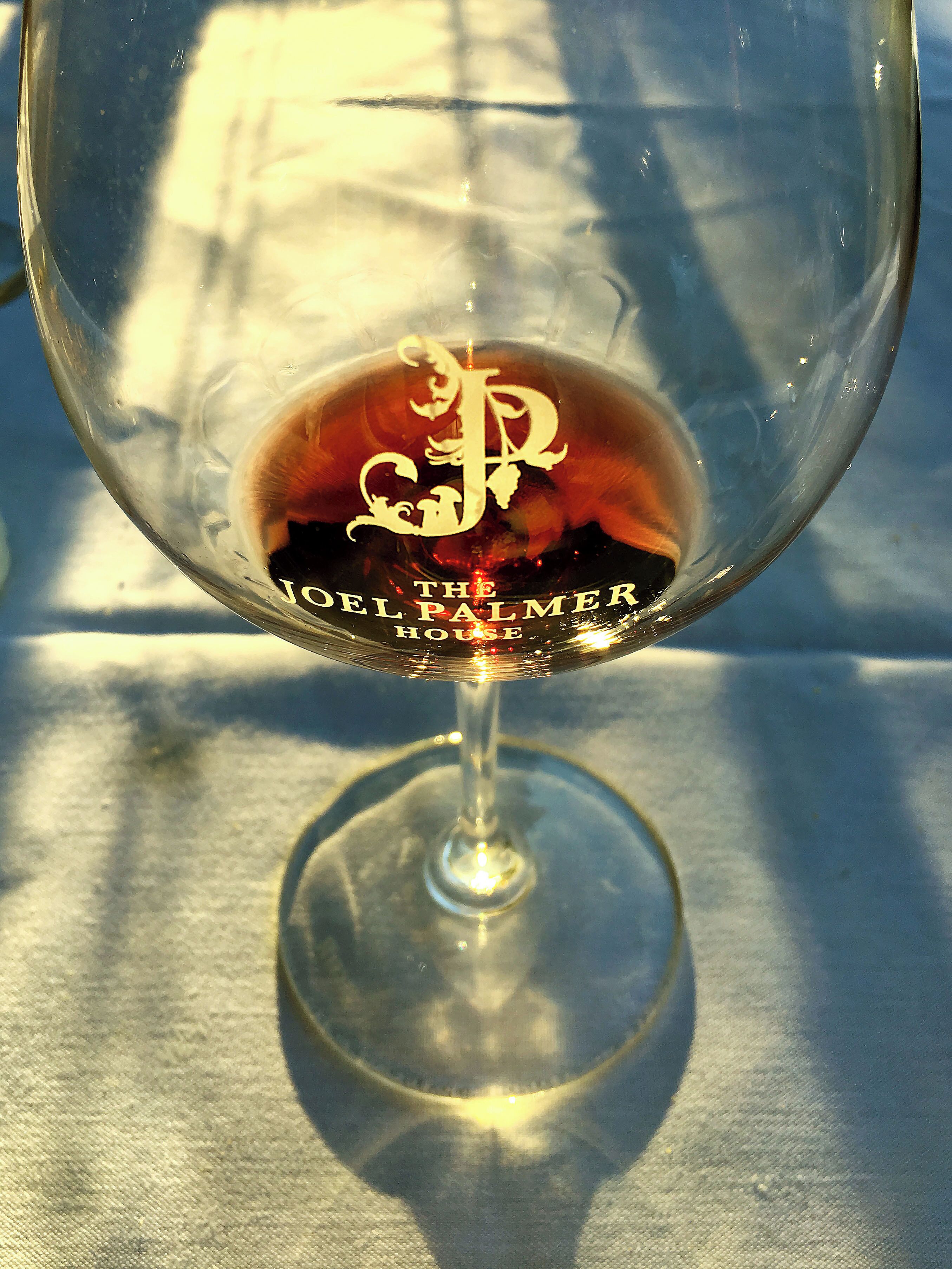 A wine glass with a logo and text reading "The Joel Palmer House".