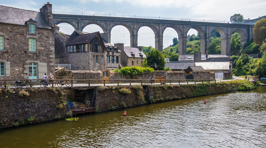 Dinan, France - August 26, 2019: Port of Dinan and Viaduct of Lanvallay over the Rance river in French Brittany
