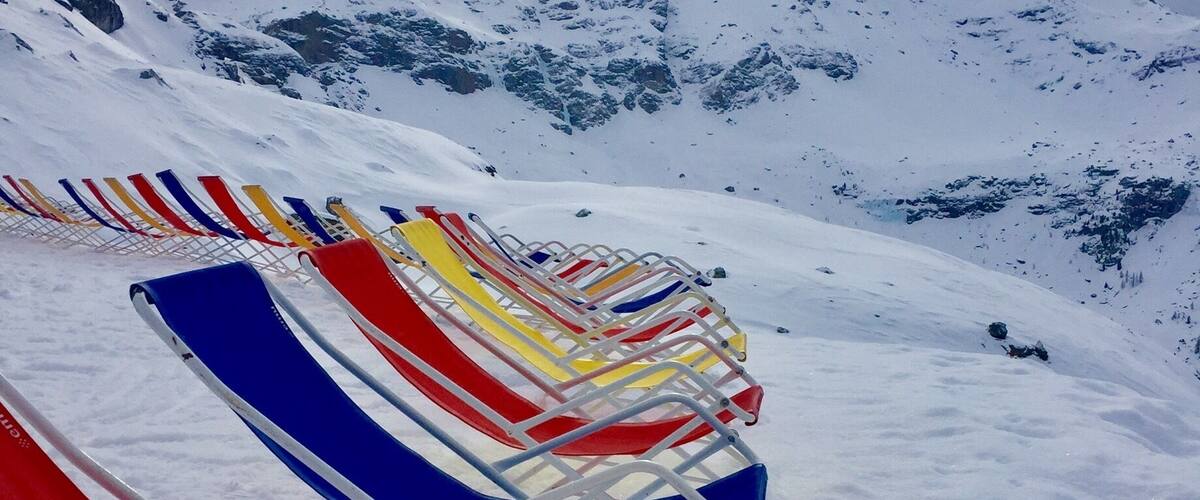 Waiting for the sunshine to appear to enjoy these colourful deckchairs.