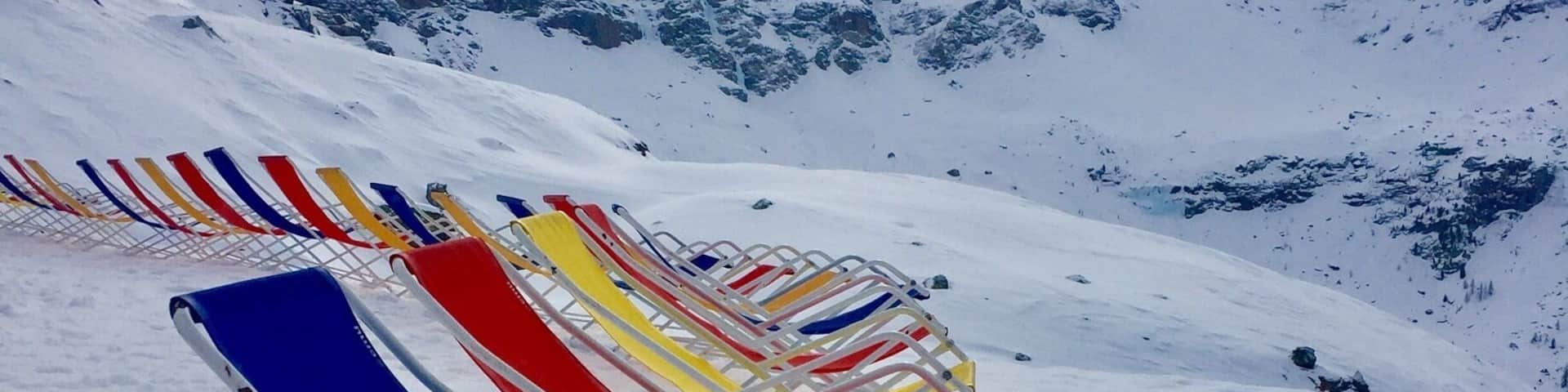 Waiting for the sunshine to appear to enjoy these colourful deckchairs.