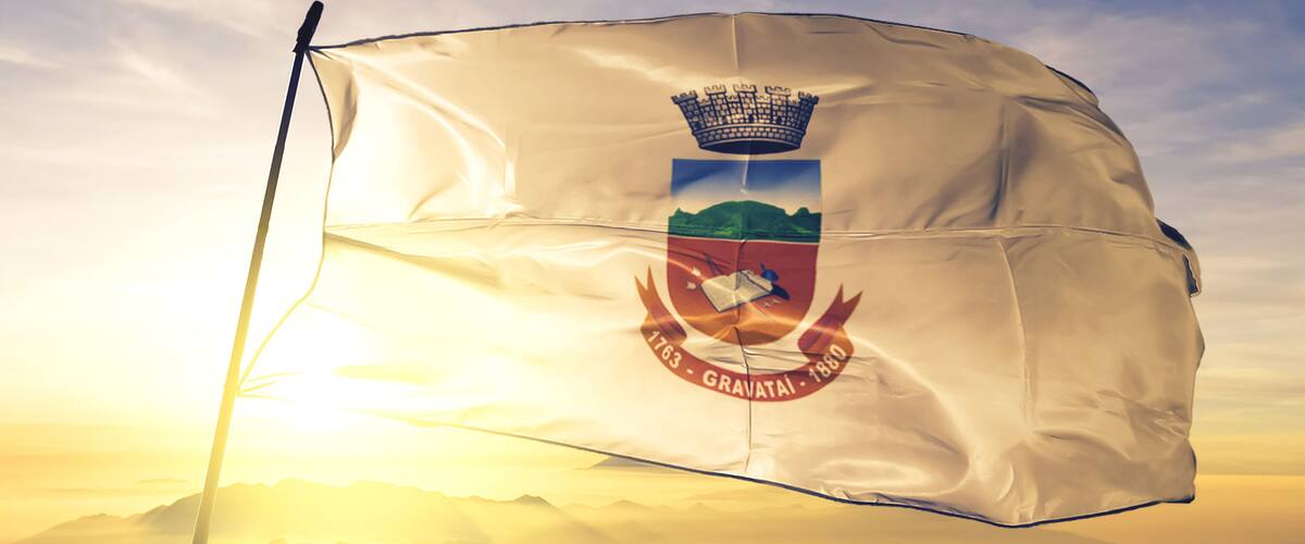 Gravatai of Brazil flag waving on the top sunrise mist fog