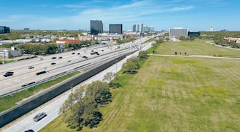 Large vacant land along busy Sam Houston Tollway in rapid growing Westchase business district, mixed of office buildings, glass skyscrapers, hotels, apartment complex, Western Houston, Texas, top