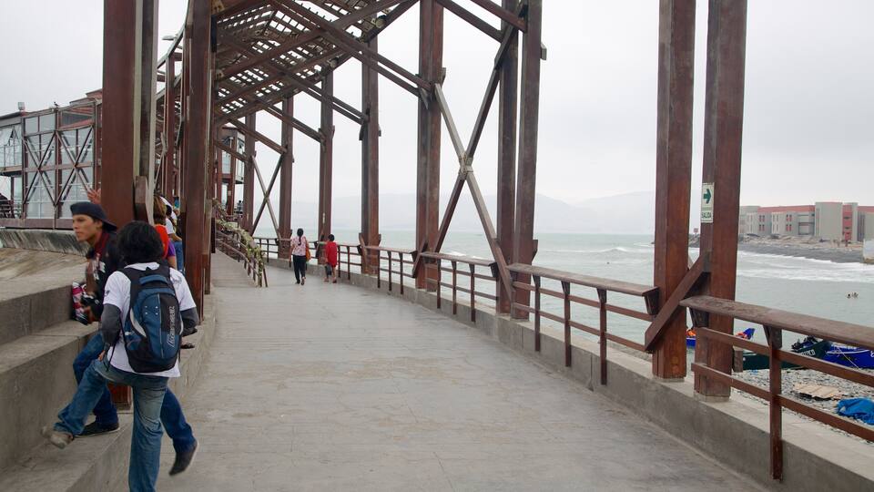 A pier with a metal framework and a concrete walkway.