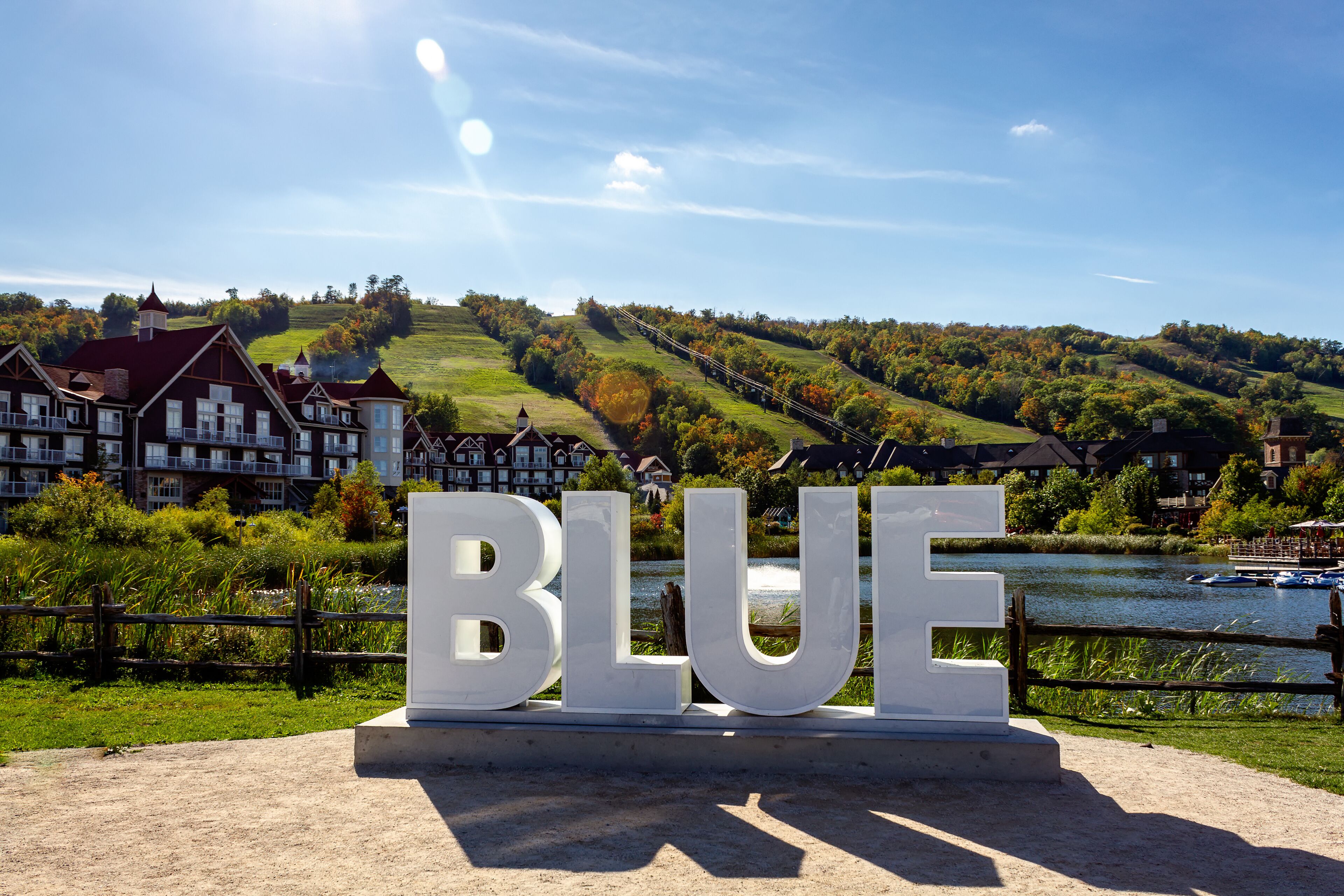 View of Mill pond and and BLUE sign, Blue Mountains Village, Ontario, Canada