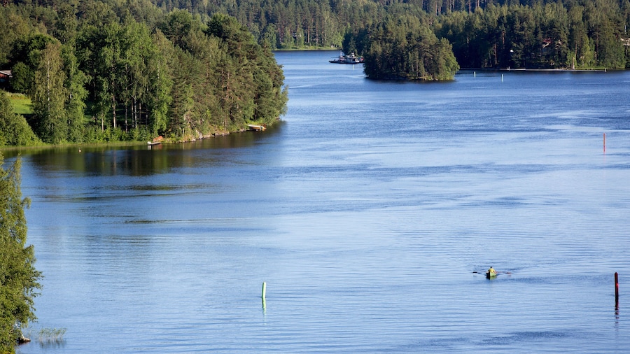 Man rowing a rowboat at Leppavirta river , Finland