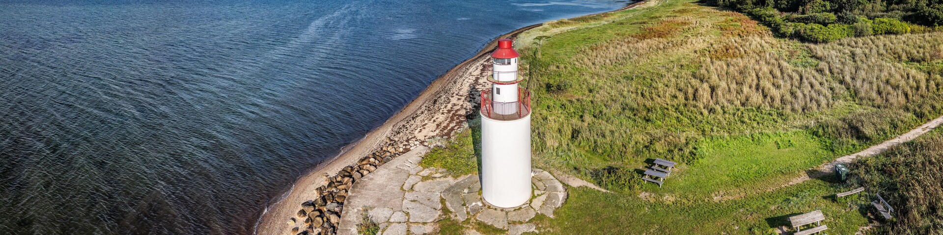 Beach at the Lighthouse at Vejle Fjord in Denmark Named Traeskohage Fyr