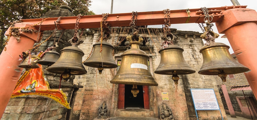 The temple bells inside the ancient Bagnath temple complex built in the Nagara style in the 15th century in the Himalayan town of Bageshwar..