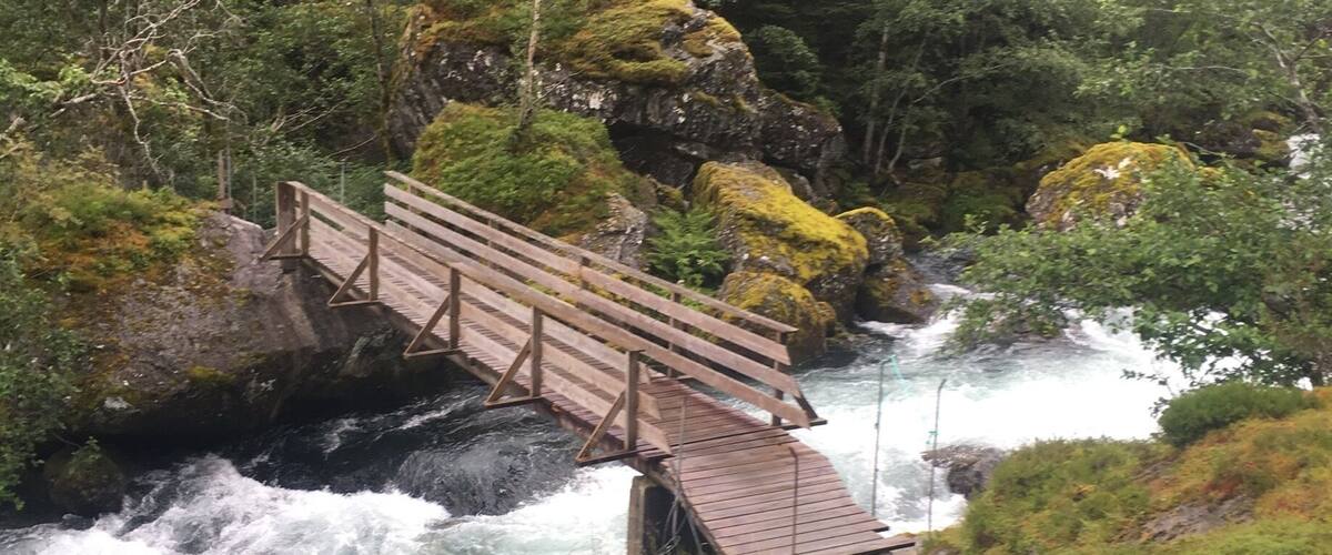 Wooden bridge going over a glacial icefall. This is on a hike from Bondhus/sunndal to Bondhusdalen lake at the bottom of the glacier #takeahike