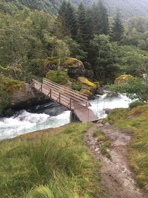 Wooden bridge going over a glacial icefall. This is on a hike from Bondhus/sunndal to Bondhusdalen lake at the bottom of the glacier #takeahike