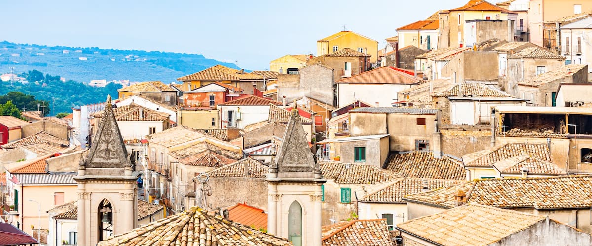Traditional Italian village scenery. Cityscape of Curinga in Calabria, Italy. Medieval cityscape skyline of small southern Italian city located on evergreen forest mountains