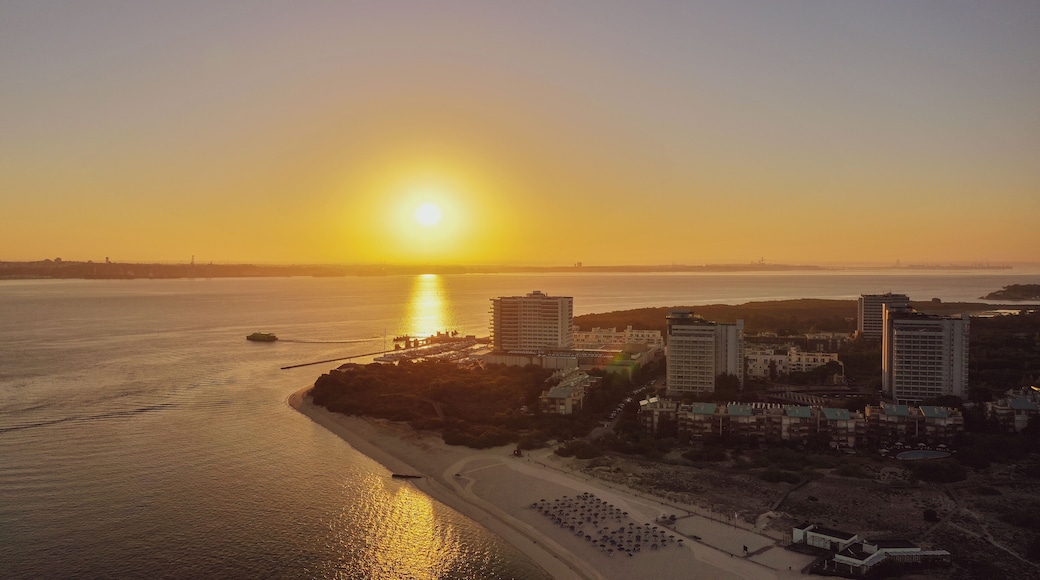 boat sailing near of troia resort of the reflection under the sun in troia peninsula, Portugal