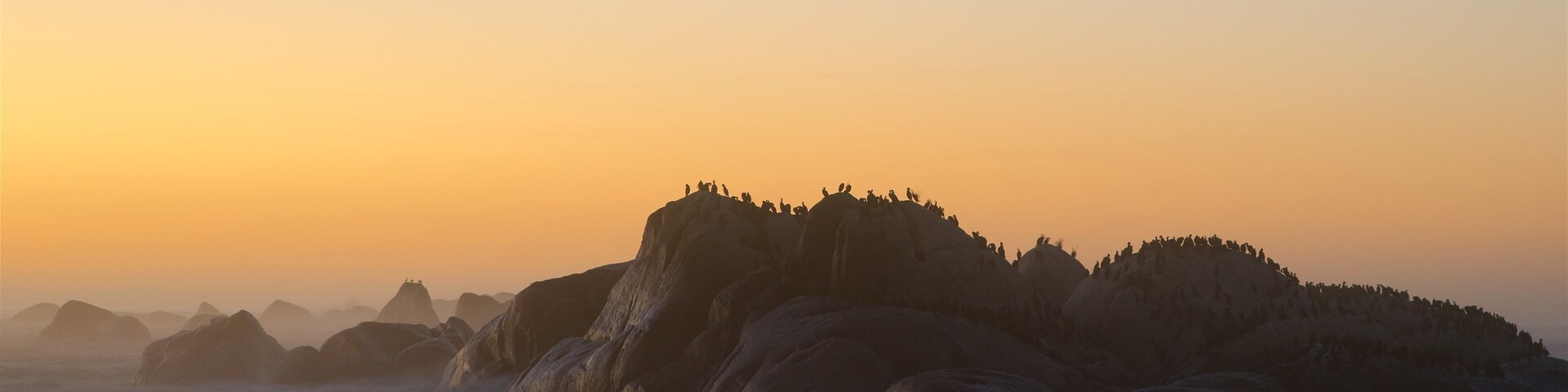 Paternoster que incluye costa escarpada y un atardecer