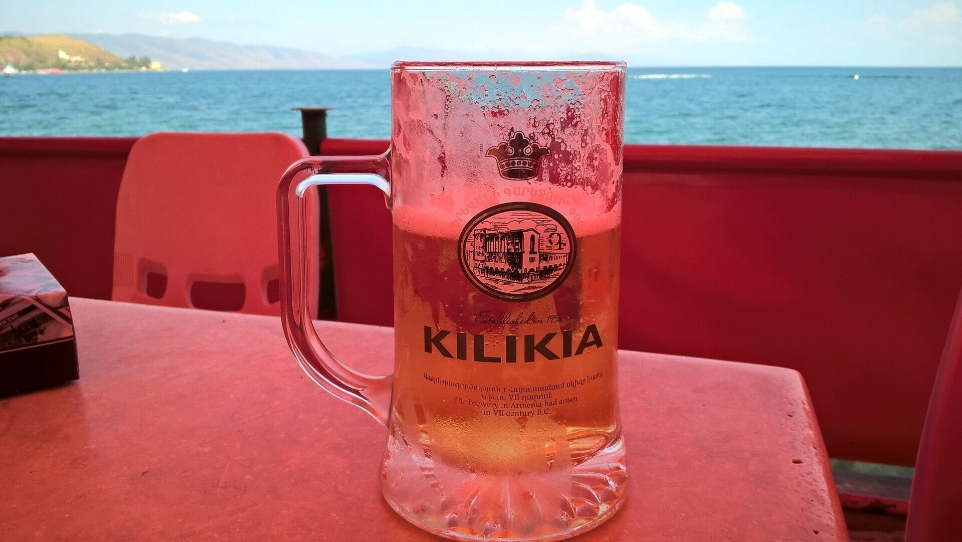 One of Armenia's most popular beers - Kilikia. View from a small, lakeside cafe on the shore of Lake Sevan. 