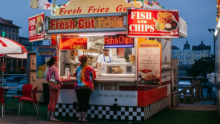 Atlantic City Boardwalk which includes markets, food and signage