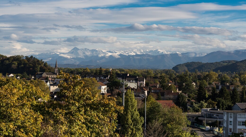 French town Pau against the winter Pyrenees mountains peaks