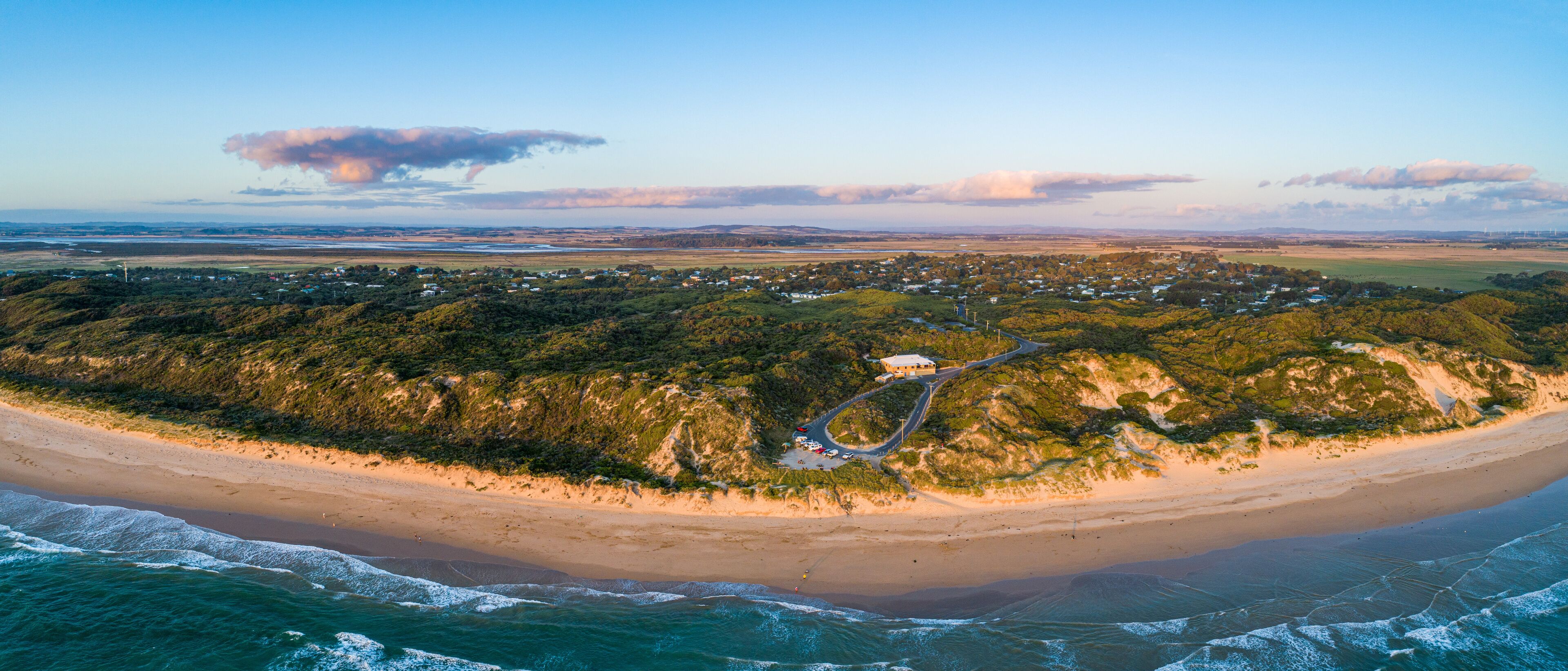 Venus Bay beach and surf club building at sunset - aerial panorama. Victoria, Australia