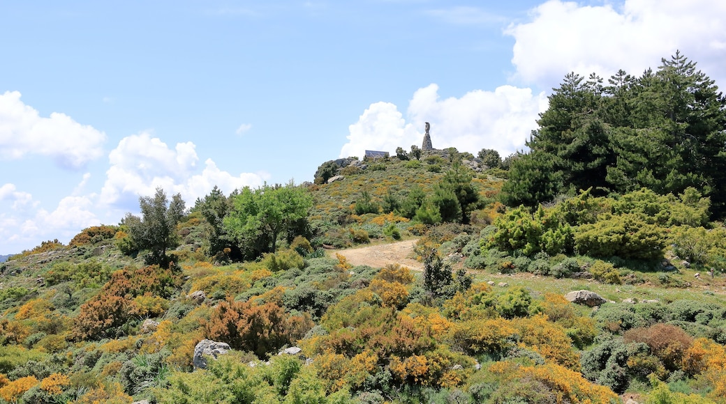 Statua San Michele on top of sardinian mountain landscape near Biddamanna Istrisàili/Villagrande Strisaili/Arzana, Italy