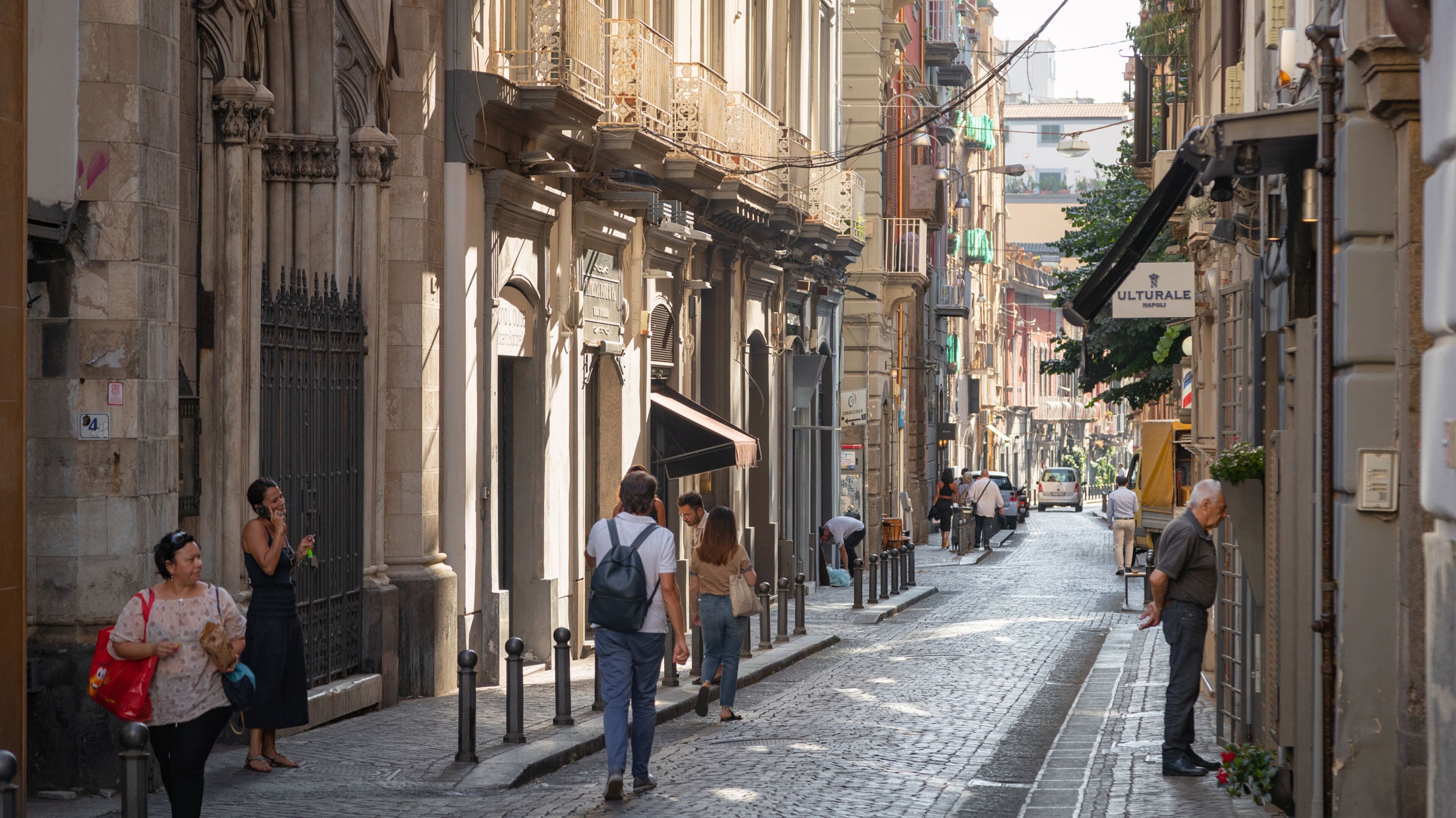 Chiaia showing street scenes as well as a small group of people