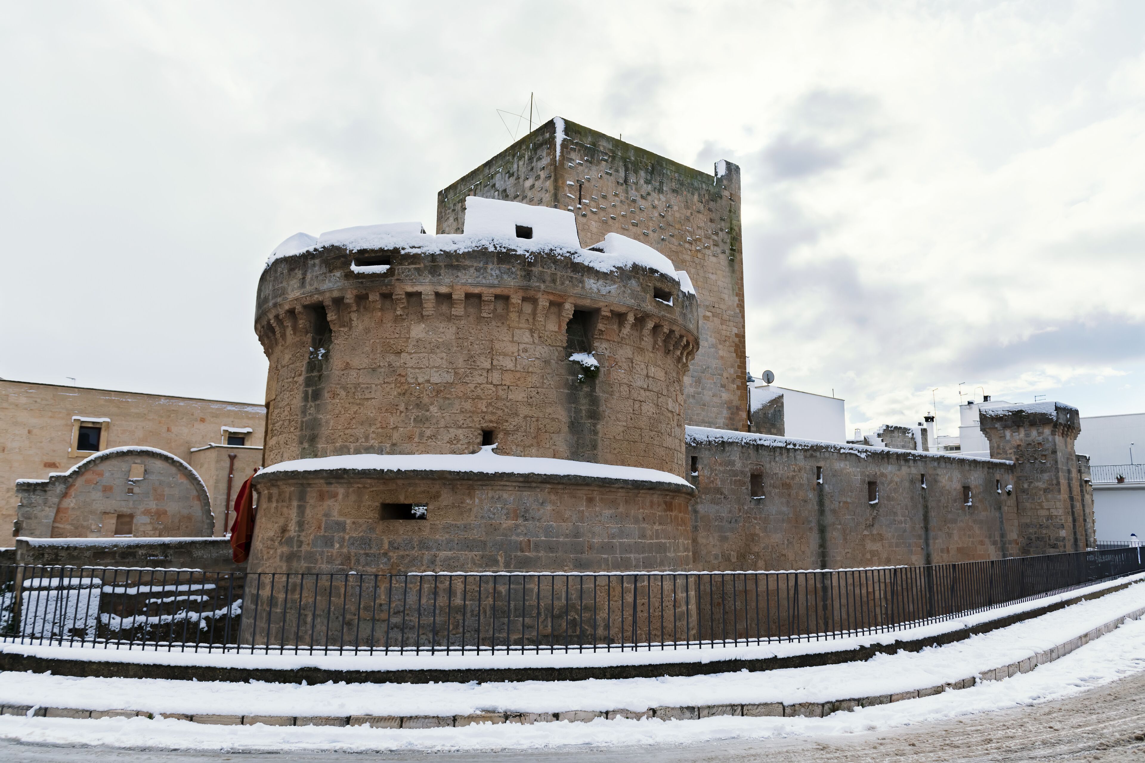 Torrione di Avetrana is part of the medieval castle, located in the historic center, after a exceptional snowfall, Salento, Apulia, Italy