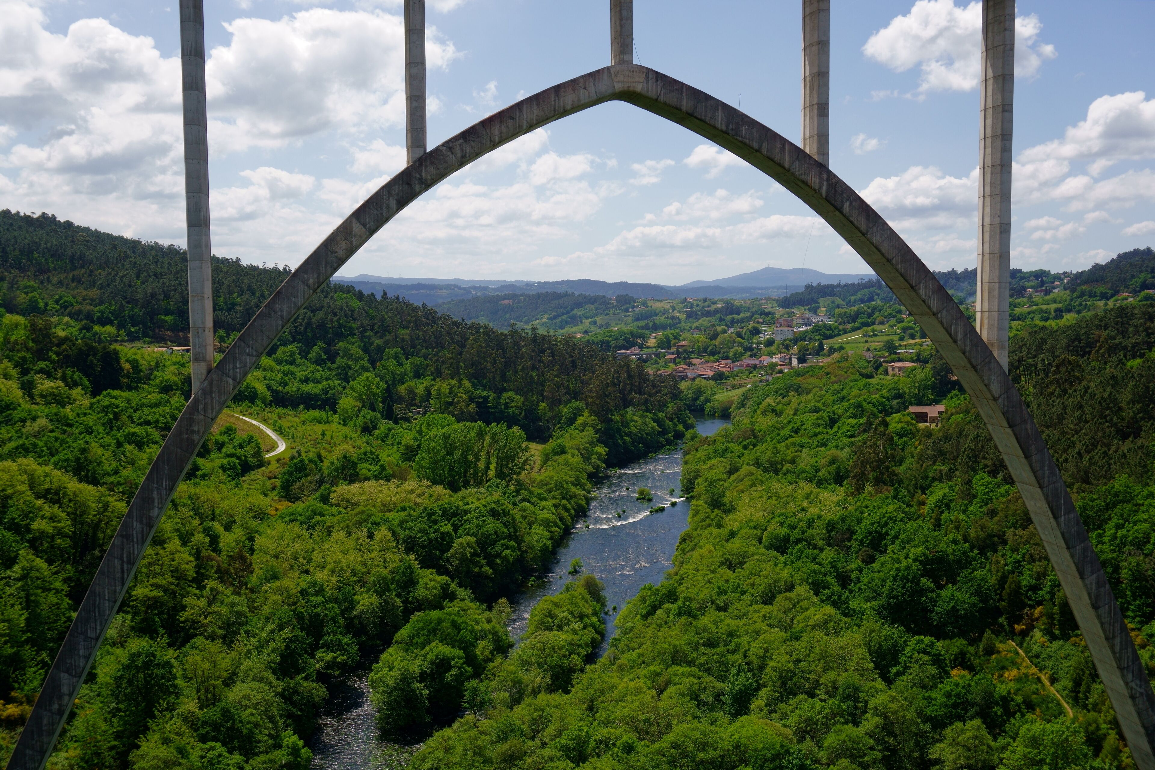 Landscape of Ulla River framed by a train bridge