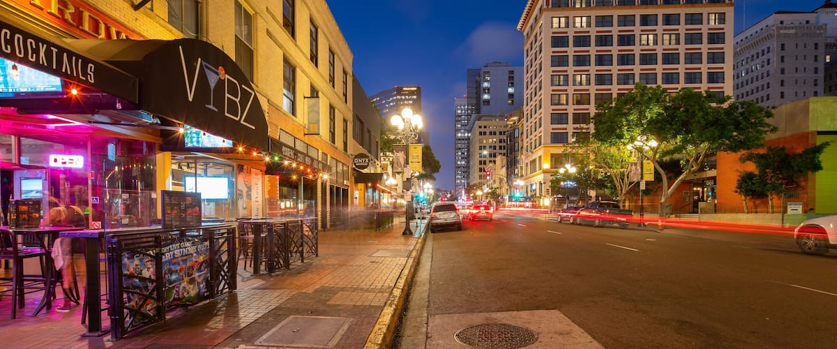 Gaslamp Quarter which includes night scenes and a city