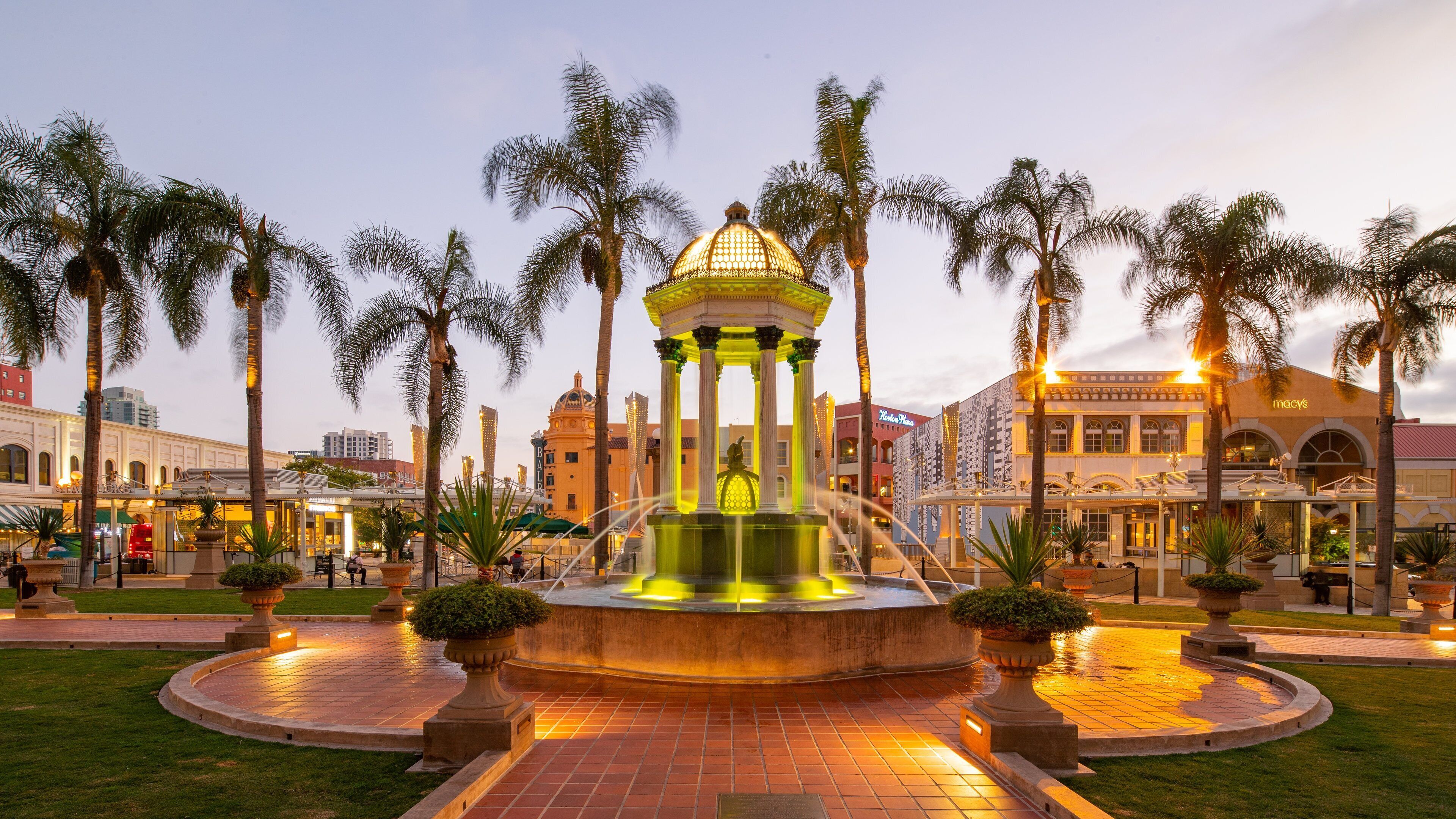 Gaslamp Quarter featuring a sunset, a fountain and a garden