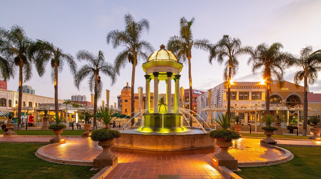 Gaslamp Quarter featuring a sunset, a fountain and a garden