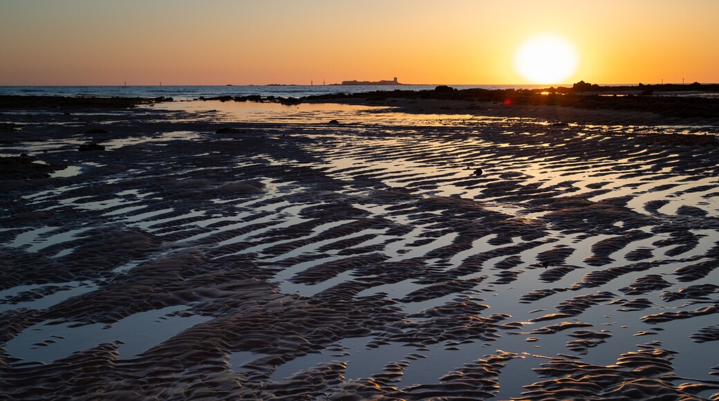 La Barrosa Beach showing a sandy beach, a sunset and general coastal views