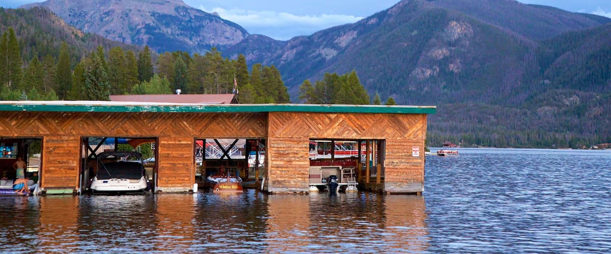 Grand Lake featuring a bay or harbour, a lake or waterhole and mountains