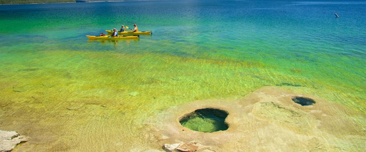 West Thumb featuring kayaking or canoeing and a lake or waterhole as well as a small group of people