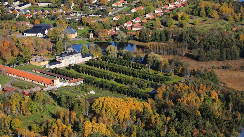 Aerial view of the Swedish village Osterbybruk during the autumn season.