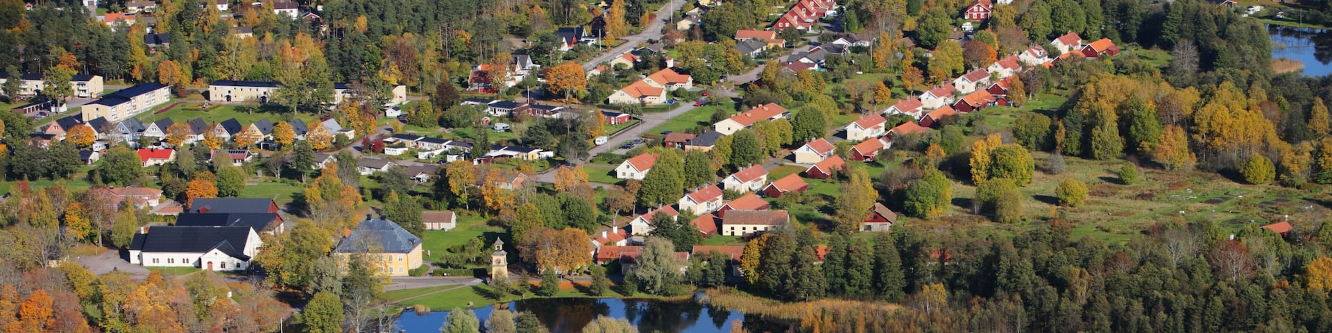 Aerial view of the Swedish village Osterbybruk during the autumn season.