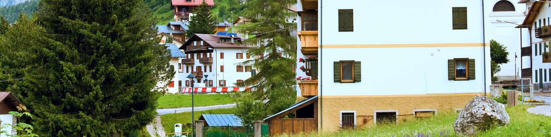 Tranquil summer Italian dolomites mountain village view from Auronzo di Cadore village