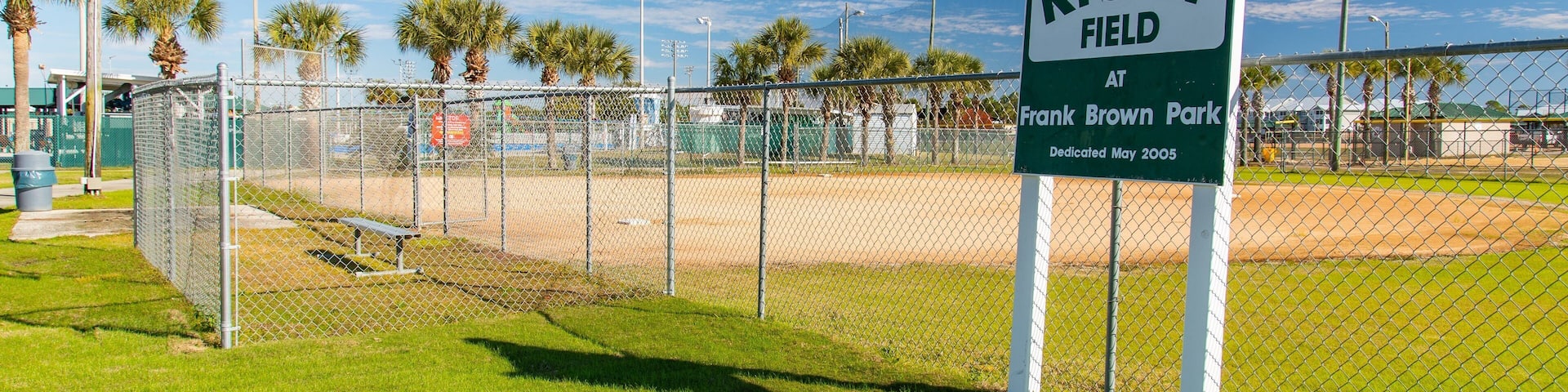Frank Brown Park which includes signage and a sporting event