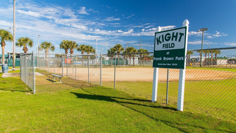 Frank Brown Park which includes signage and a sporting event