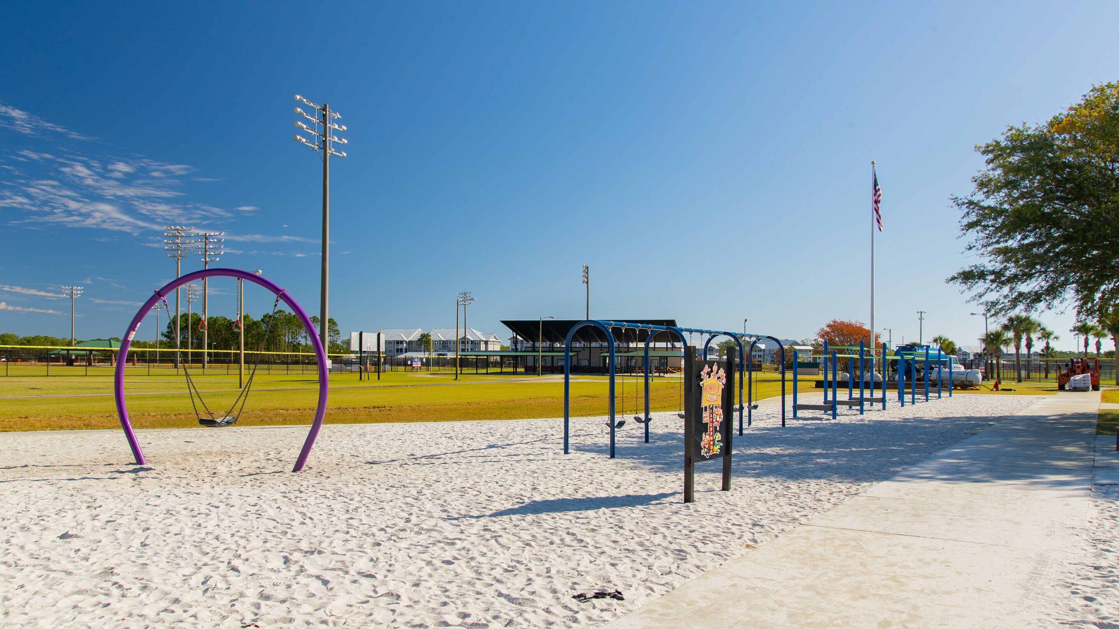 Frank Brown Park showing a playground and a beach