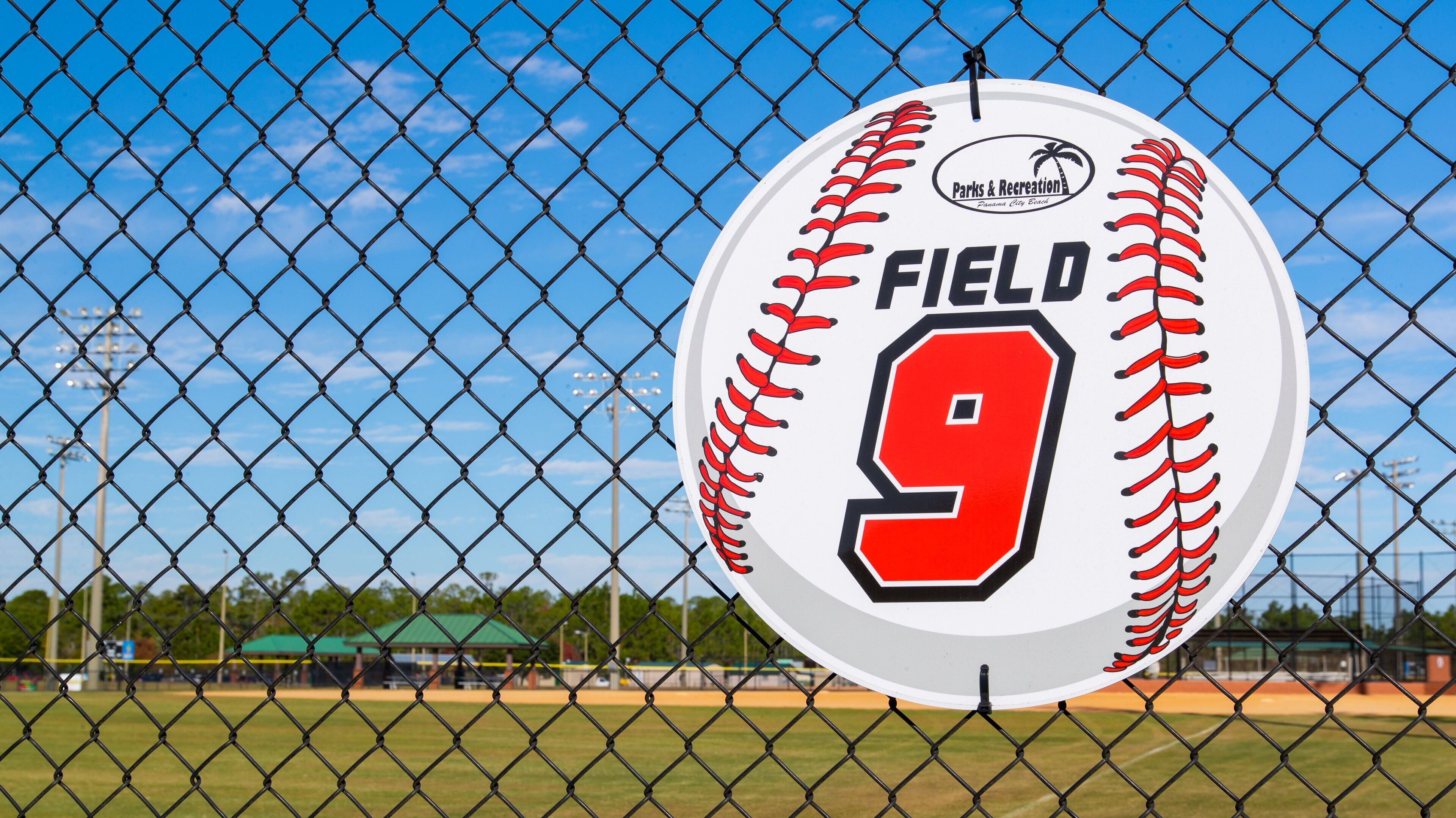 Frank Brown Park showing a sporting event and signage