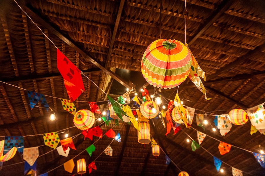 Traditional flags and lanterns of June festivities in northeastern Brazil. Background colorful.
