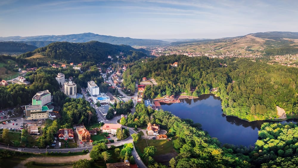 Aerial panoramic drone shot of Sovata city with Ursu Lake