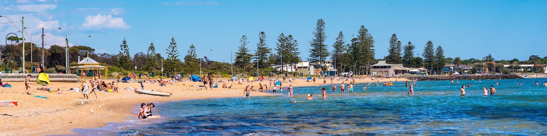 A sunny day with people at Elwood Beach in Elwood, Victoria, Australia