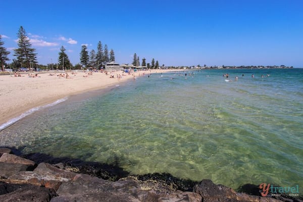 Elwood Beach in Melbourne is a popular bayside beach during sunny days and a great family beach. It’s not as accessible from the city as St Kilda as it’s not exactly on the tram or train line, but still only 8km’s away if you have a car, or jump in a cab.
The water was clean and calm for swimming and our kids had a great time playing on the sand and the rocks. It’s another fairly active beach and you’ll see people windsurfing, cycling, playing cricket and walking.