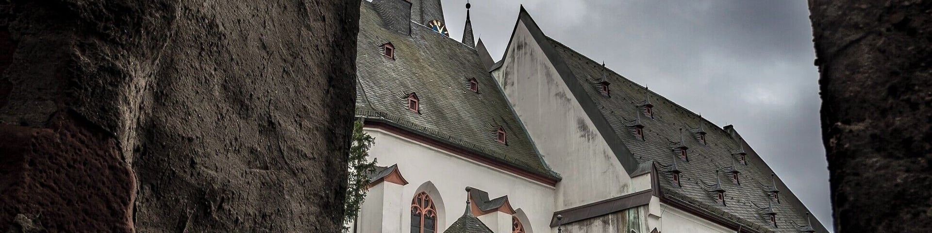 A church with a steeply pitched roof and a prominent tower.